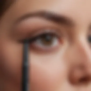 A close-up of a brow pencil demonstrating its precise tip and smooth application.