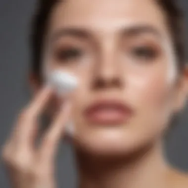 Close-up of a person applying a gentle cleanser to their face