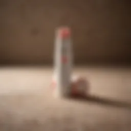 Close-up of a tube of natural chapstick against a textured background.