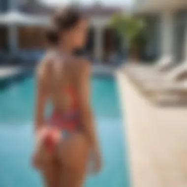 Stylish woman wearing backless tankini by the pool