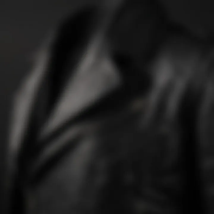 Close-up view of the AllSaints black leather jacket showcasing its texture and stitching