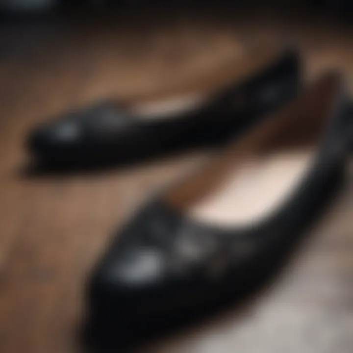 Close-up of designer black flats showcasing intricate details