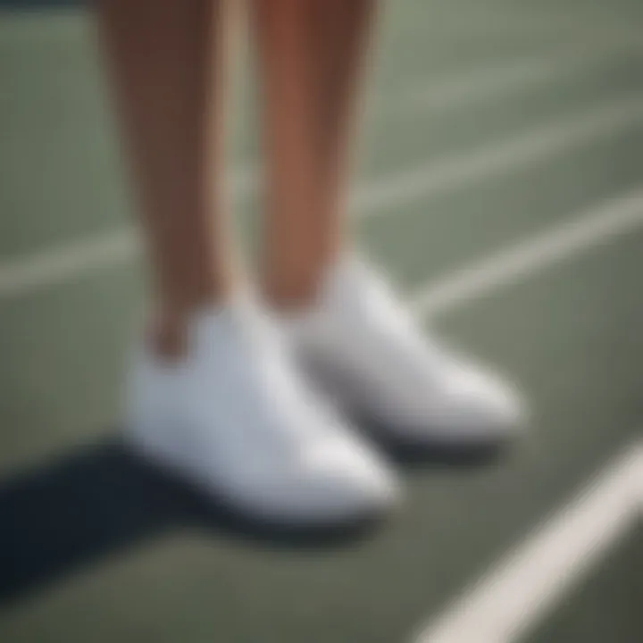 Elegant white adidas tennis shoes on a court