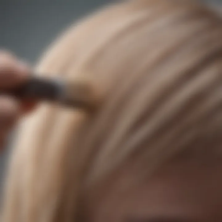 A close-up of hair being carefully toned with a brush