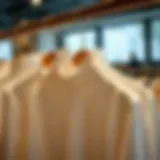 A stylish turtleneck shirt displayed on a wooden hanger