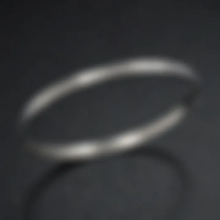 Close-up of a medical alert bangle with engraved health information