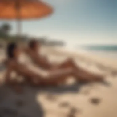 A peaceful beach setting with sunbathers enjoying the sun.