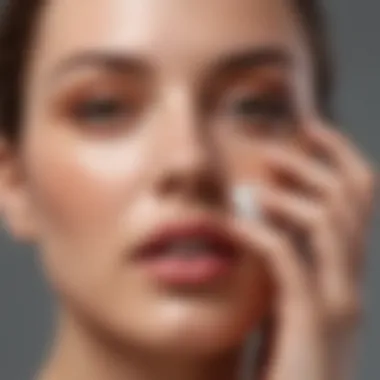 Close-up of a hand applying tinted sunscreen to a flawless complexion